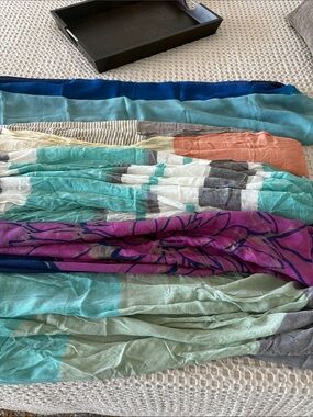 5 separate scarves. 3 are Infinity scarves the purple is new with tags.